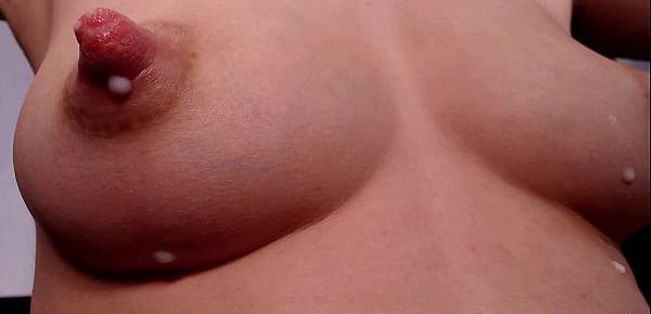  Brunette girl giving milk from her big nipples in close up